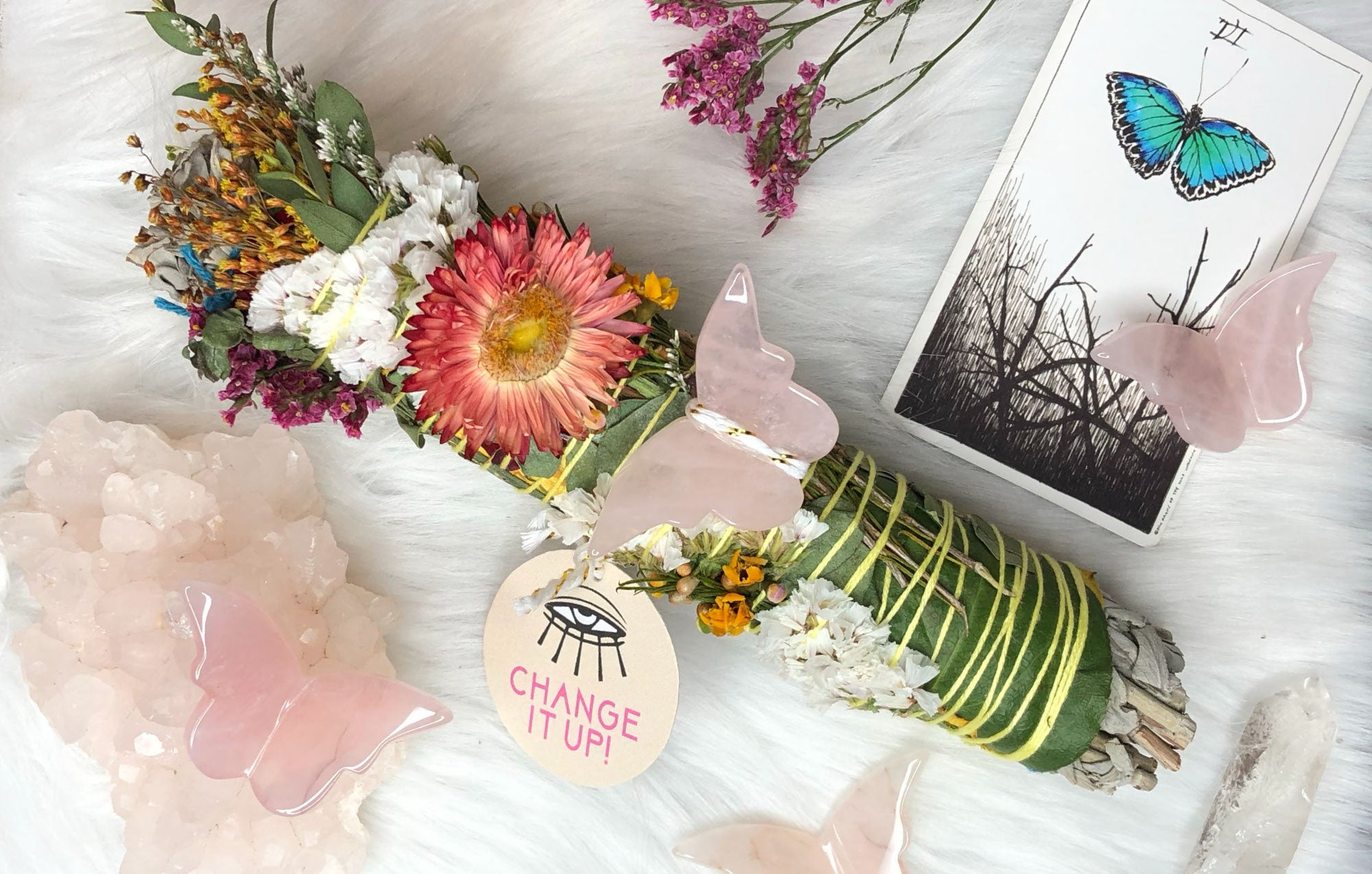 large floral wrapped sage bundle with rose quartz butterfly crystal promoting change