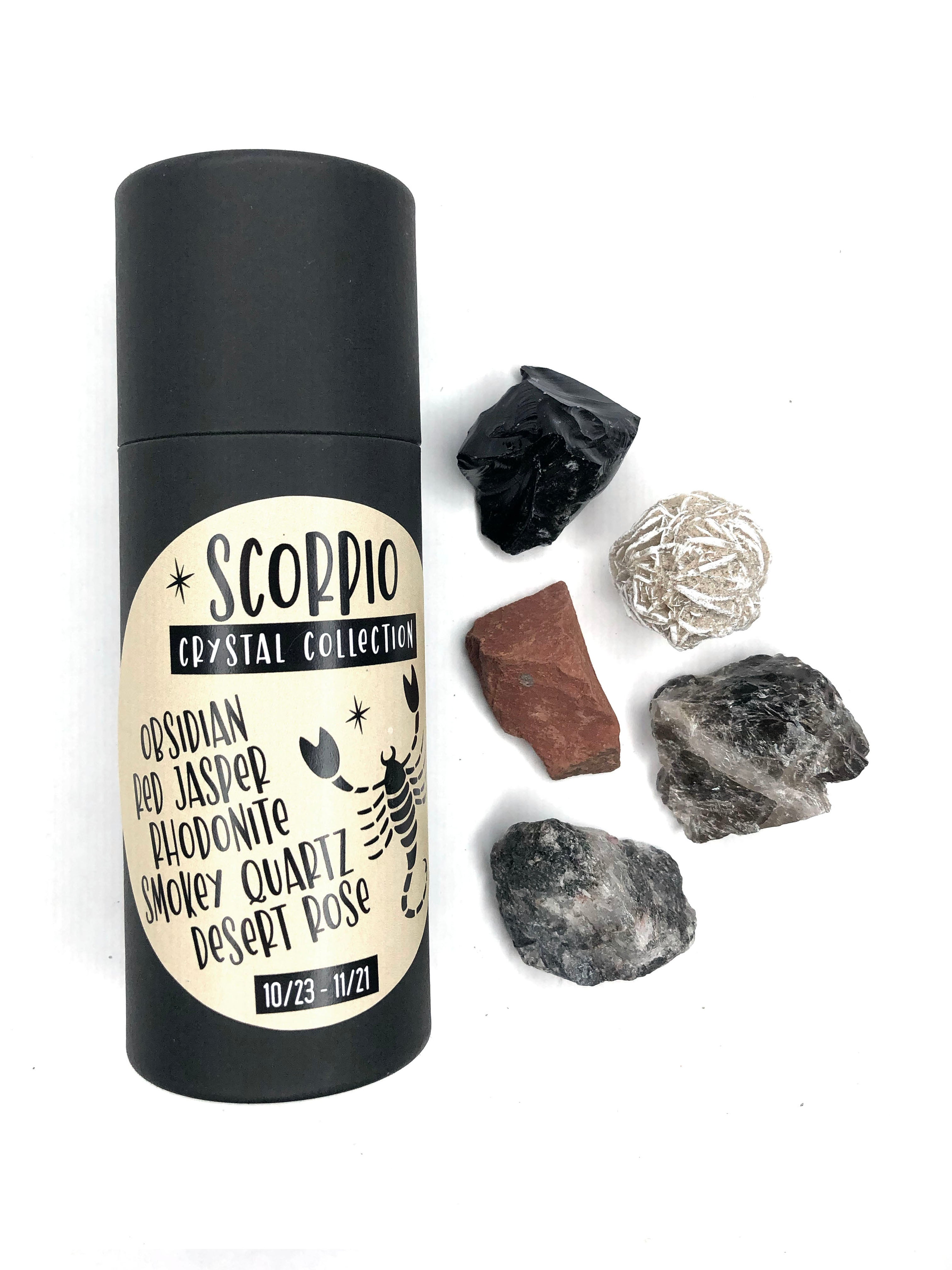 zodiac crystal collection for scorpio zodiac sign includes black obsidian, red jasper, pink rhodonite, gray smokey quartz and white desert rose on white background