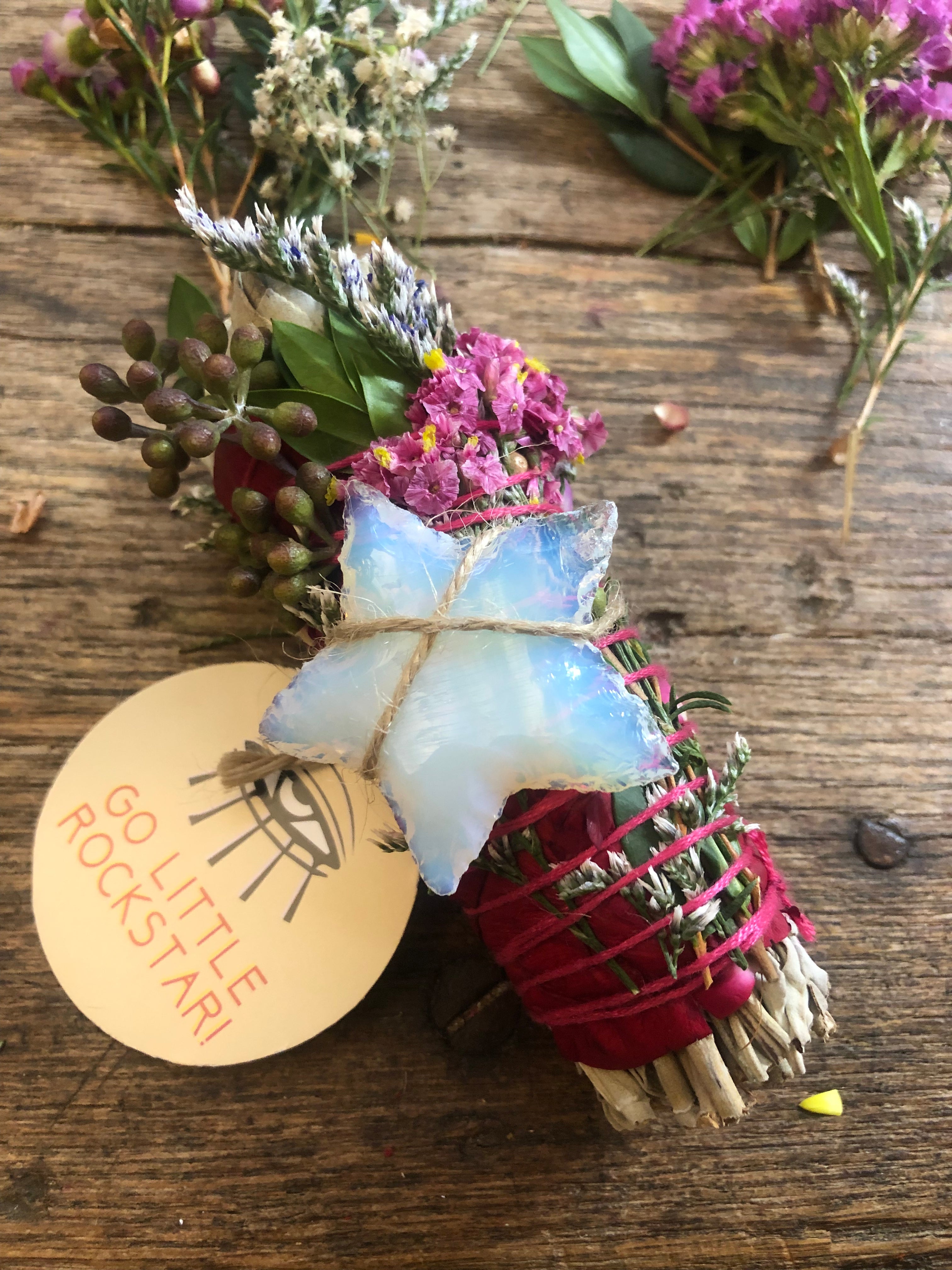 4" white sage smudge cleansing bundle with eucalyptus and florals with white opalite crystal star attached to promote a rockstar energy clearing
