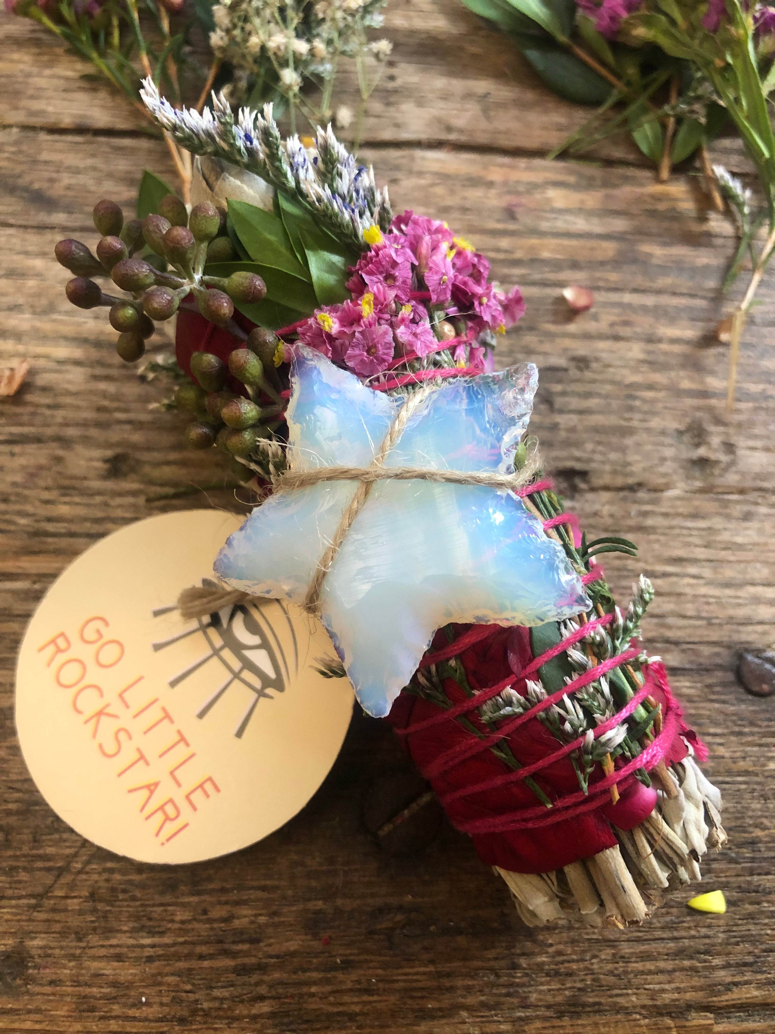4" white sage smudge cleansing bundle with eucalyptus and florals with white opalite crystal star attached to promote a rockstar energy clearing