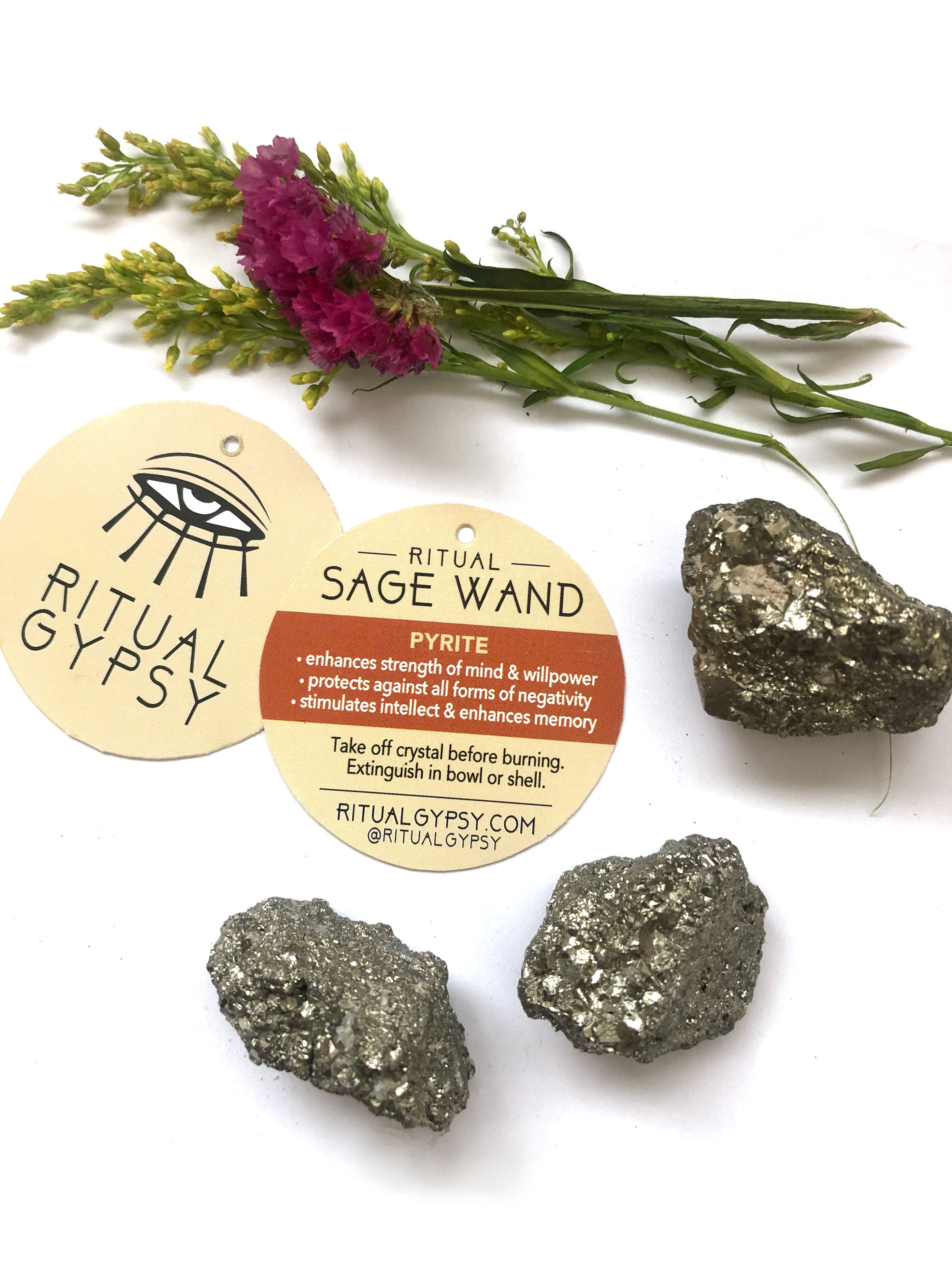 3 gold pyrite crystals and round ritual gypsy product tag on white background