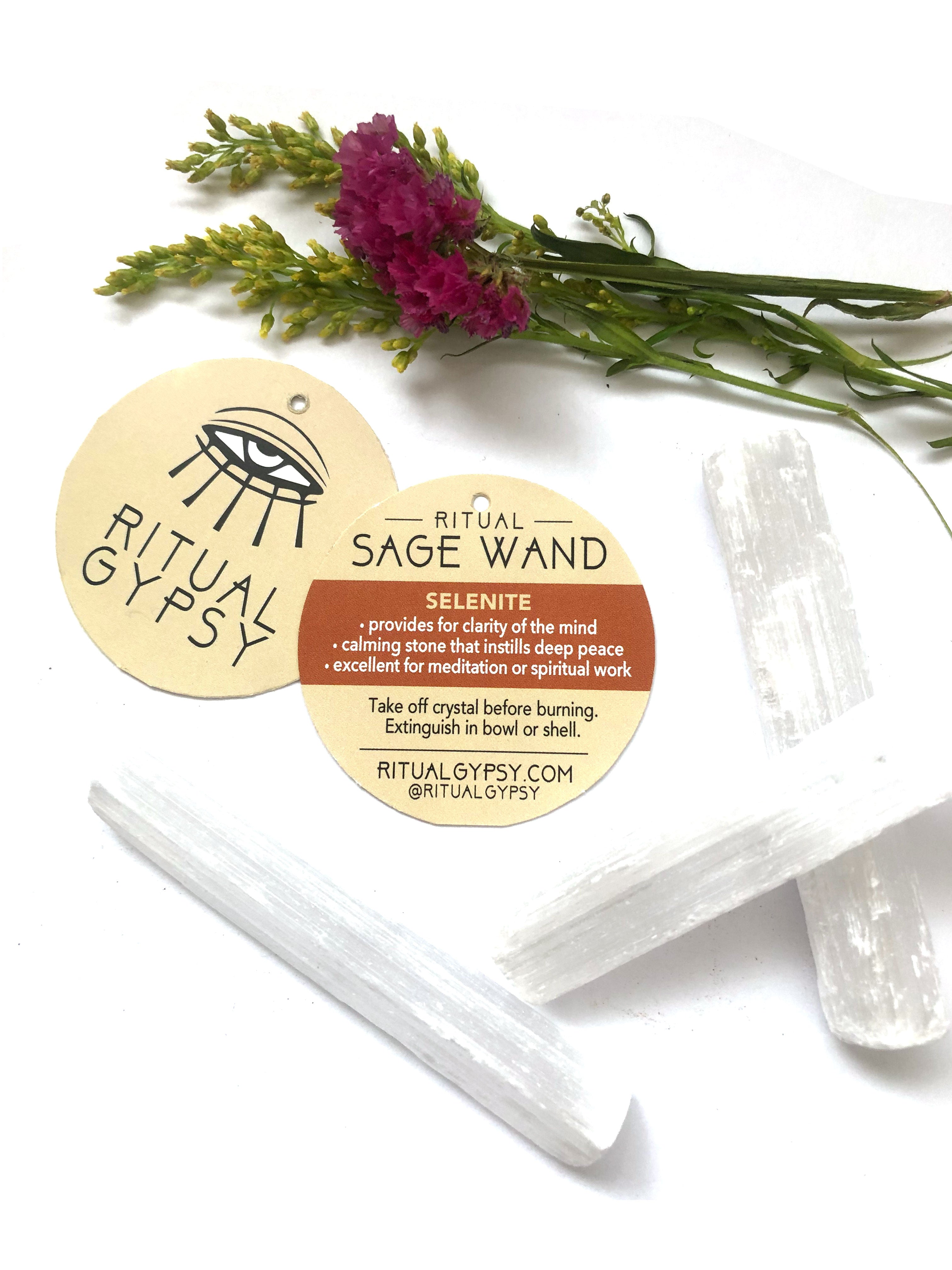 selenite crystals with round ritual gypsy product tags on white background