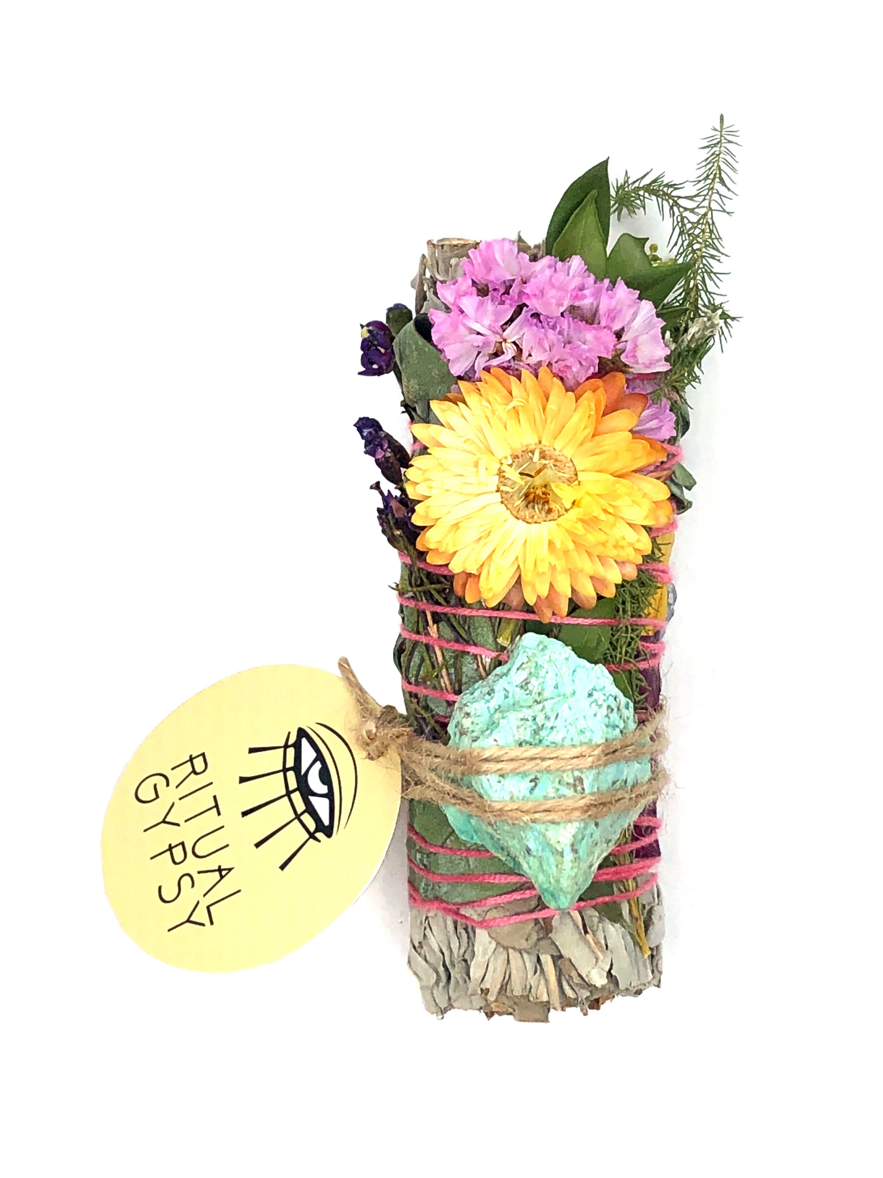 4" small white sage smoke cleansing smudge bundle with pink and purple statice and orange yellow strawflower wrapped in florals with white turquoise crystal and round ritual gypsy product tag
