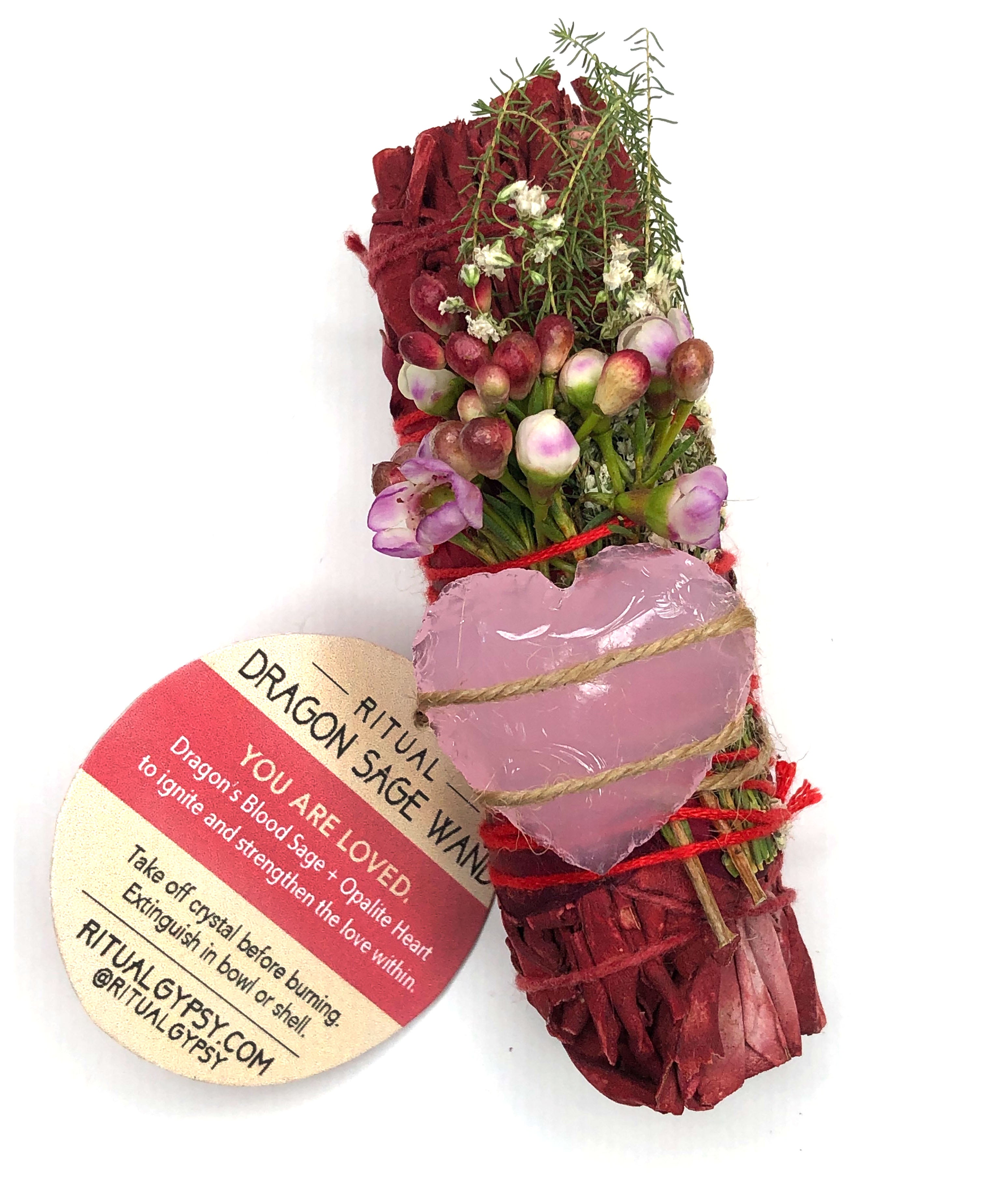 4" dragon's blood sage smoke cleansing smudge bundle with pink wax flowers and white baby's breath and wrapped in red rose petals and pink opalite heart crystal attached for love